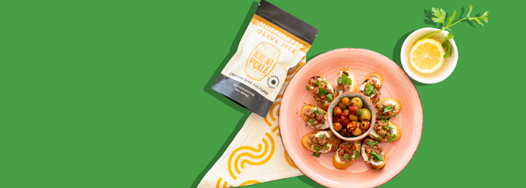 Muffuletta Crostini with Goat Cheese & Fresh Herbs