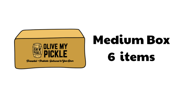A yellow pickle box with the text "" on it, indicating the brand. The box is placed on a surface with a dark background