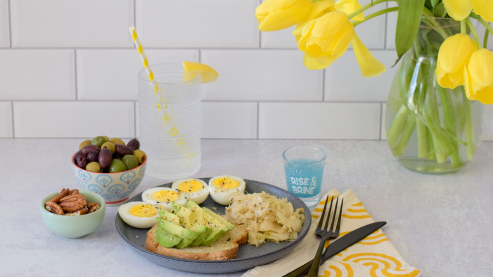April_Mobile.png: A table with a plate of food, including eggs, toast