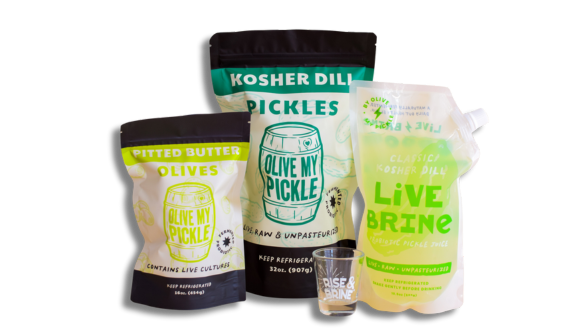 Three bags of pickles from The bags are labeled 'Kosher Dill Pickles', 'Butter Pickles', and 'Live Pickles'