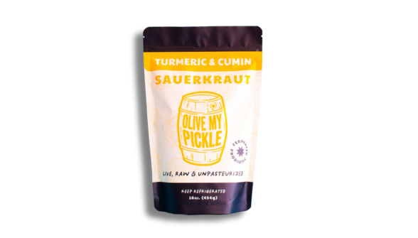 Sauerkraut with turmeric, 16 oz, in a jar. A fermented food product from, a brand that specializes in fermented foods. The jar is labeled with the product name and quantity