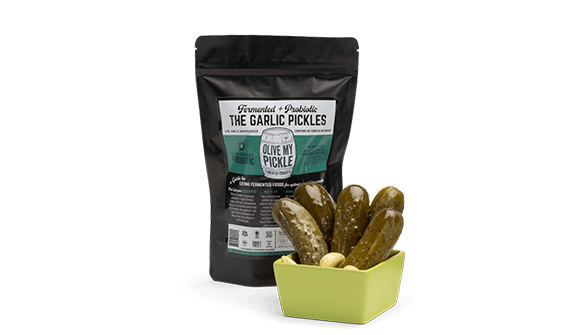 Pickles in bowls front of their packaging